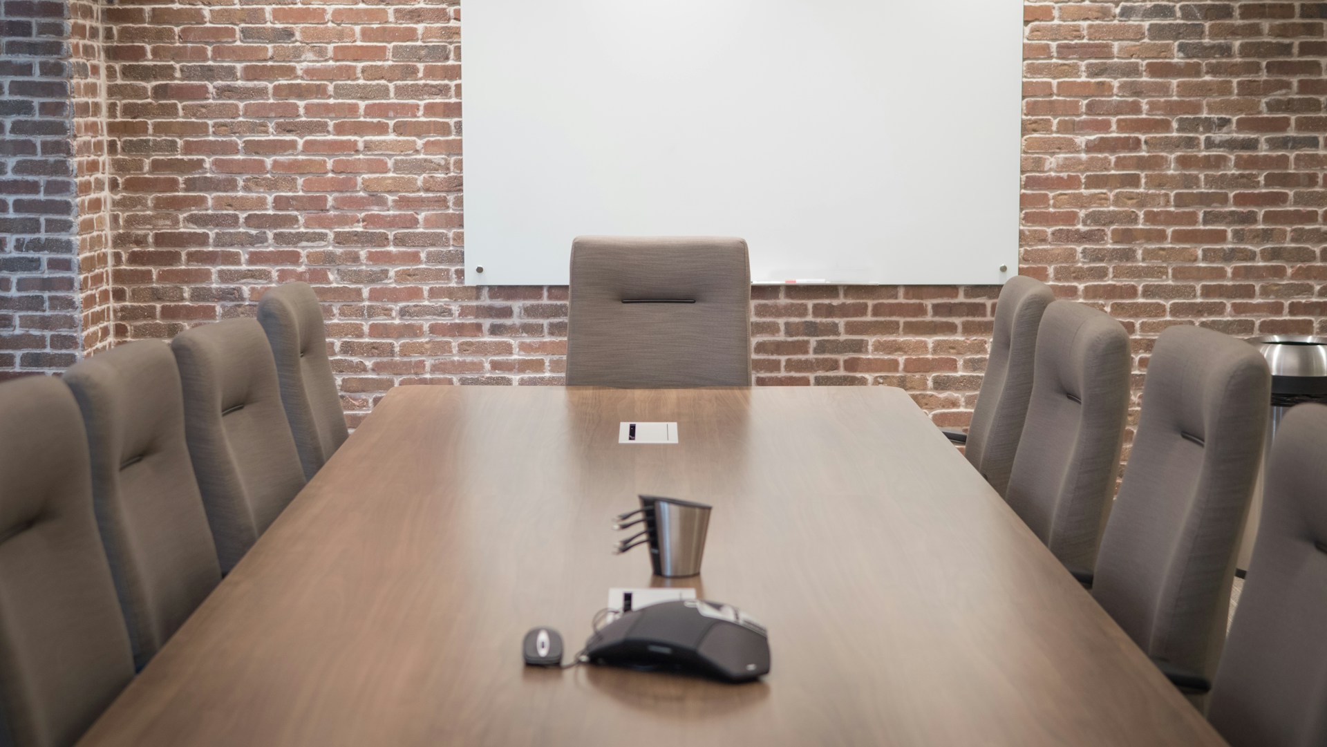Team members discussing work around a meeting table.